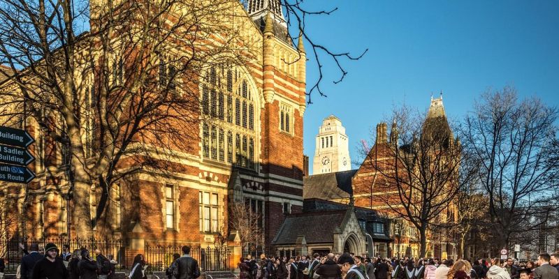 Students who are graduating and their families outside the Great Hall on a sunny winter's day