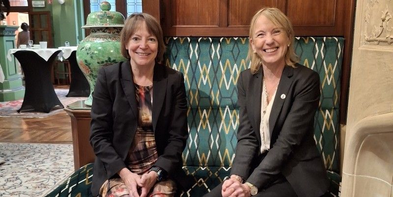 Professor Shearer West, Vice-Chancellor and President, University of Leeds and Margareth Hagen, Rector of the University of Bergen sat on a chair smiling at the camera.