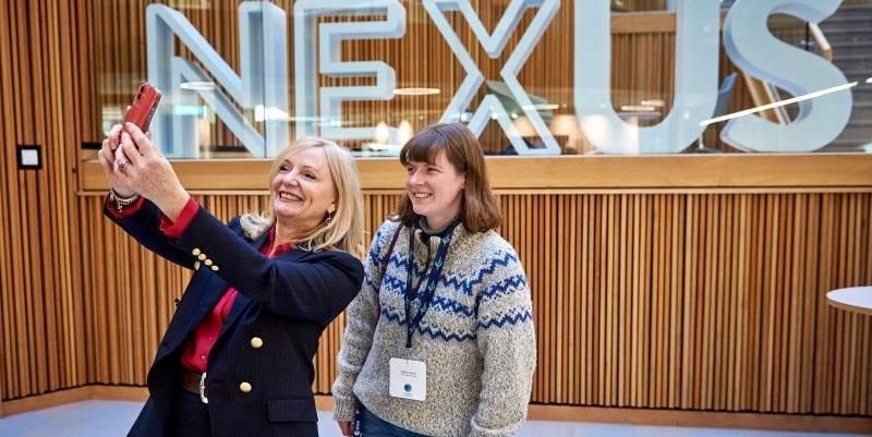 The Mayor of WEest Yorkshire, Tracy Brabin, takes a selfie with doctoral researcher Emily Dowd in the foyer of the Nexus building at Leeds.