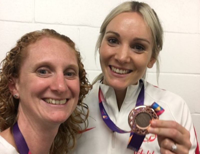 Kathy Fairclough poses with Natalie Metcalf - who holds her medal - at the Netball World Cup