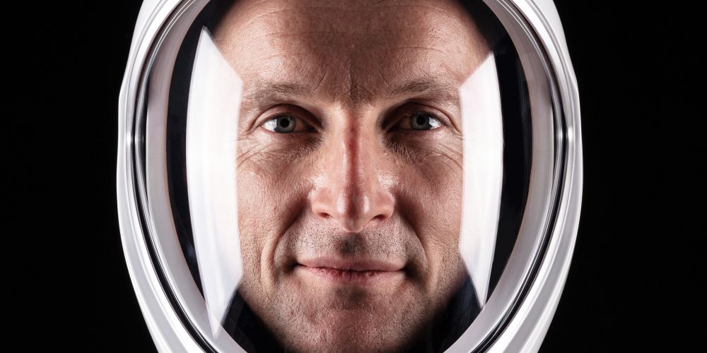 Astronaut Matthias Maurer wearing looking through an astronaut helmet.