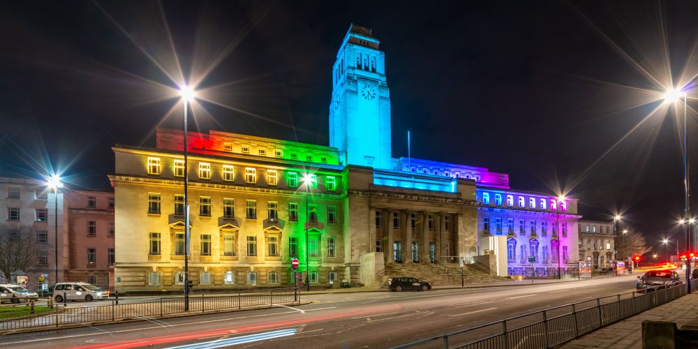 The Parkinson building is lit up in a rainbow of colours at night