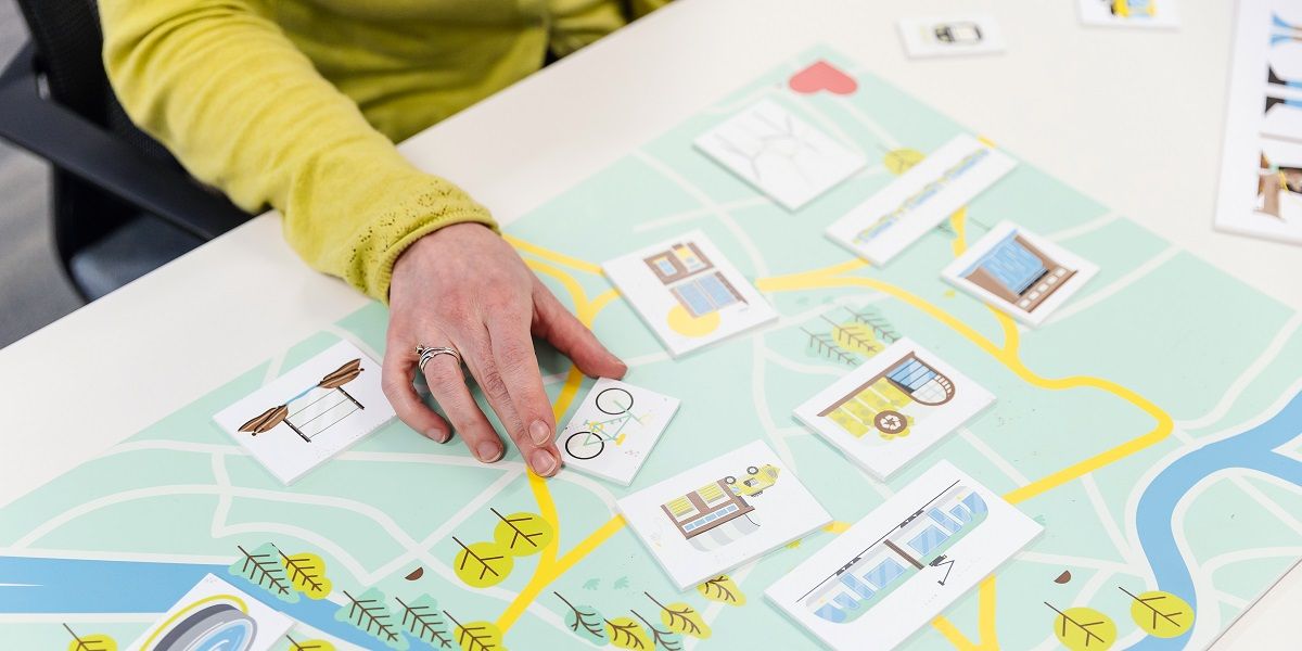 Board game for locating energy infrastructure