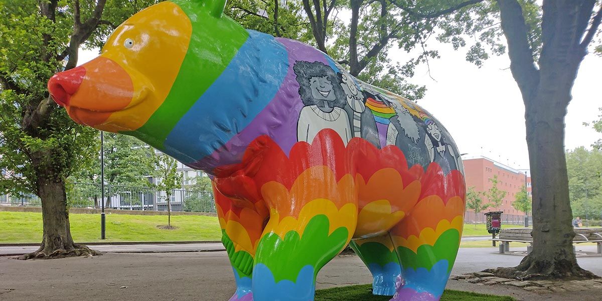 Spectrum Bear, patterned with a rainbow, on the University of Leeds campus.