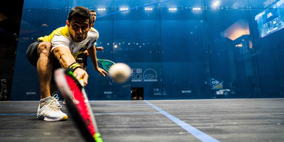 Saurav Ghosal reaches for ball in front of camera playing squash