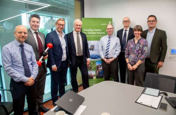 Minister for Energy Security and Net Zero with a group of seven team members of the Priestley Centre for Climate Futures