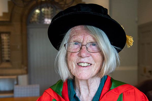 Portrait of Eleanor Joy Dodson in graduation gown and cap.