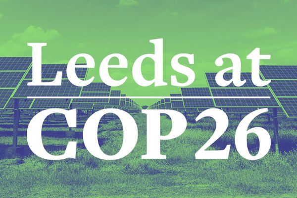 Field of solar panels with the text Leeds at COP26