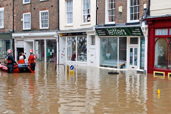 A rescue team helps residents out of properties in Walmgate York during the Christmas floods in 2015. Editorial credit: M Barratt / Shutterstock.com