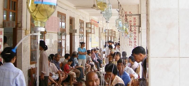 Picture shows people in a hospital in rural China attached to antibiotic drips