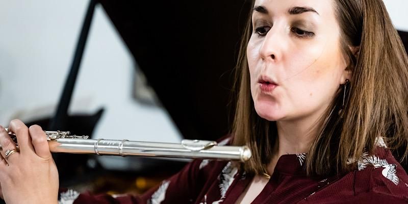 Solo and orchestral flautist, Kathryn Williams, playing the flute.