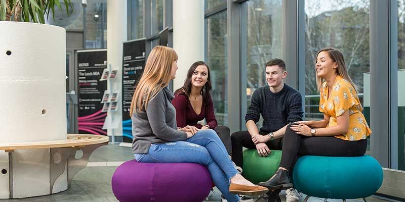 Students talking in the Business School foyer