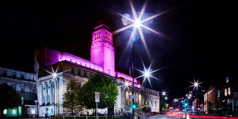 The Parkinson Building lit up pink as part of Light Night