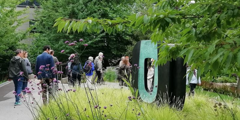 People on a public art walk on the University of Leeds campus.