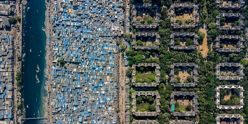 This is a satellite image which shows a large informal community that has grown up alongside a traditional bricks-and-mortar neighbourhood. It shows the differences between the urban poor and those who are richer.