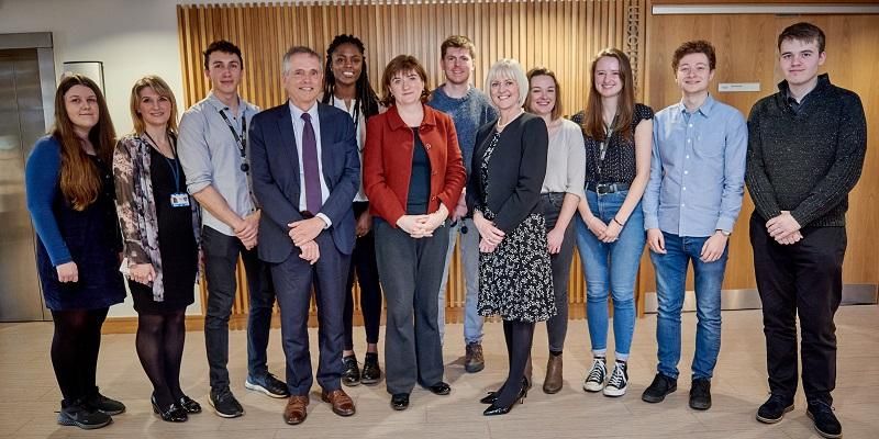 The images shows Nicky Morgan, Secretary of State for Digital, Media, Culture and Sport, Lisa Roberts, the Deputy Vice Chancellor and students on the doctoral training programme for AI in medical diagnosis