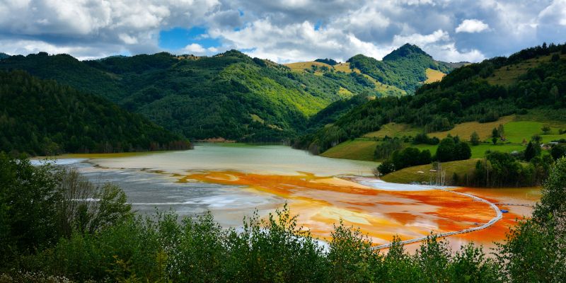 Red polluted lake in Geamana, Romania