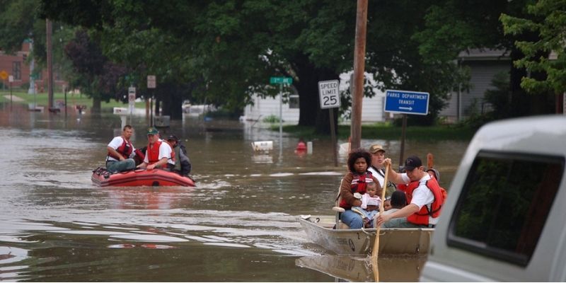Flood Victims on boats, being rescued.