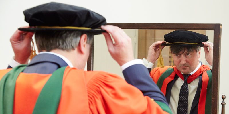 Professor Simon Armitage prepares to receive his honorary degree at the University of Leeds in July, 2015