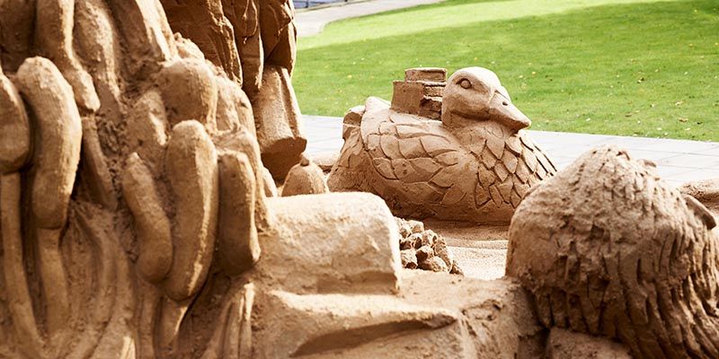 A section of a large sand sculpture depicting the University of Leeds campus and various wildlife, including a duck.