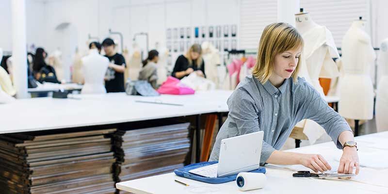 People working with fabric in a fashion lab