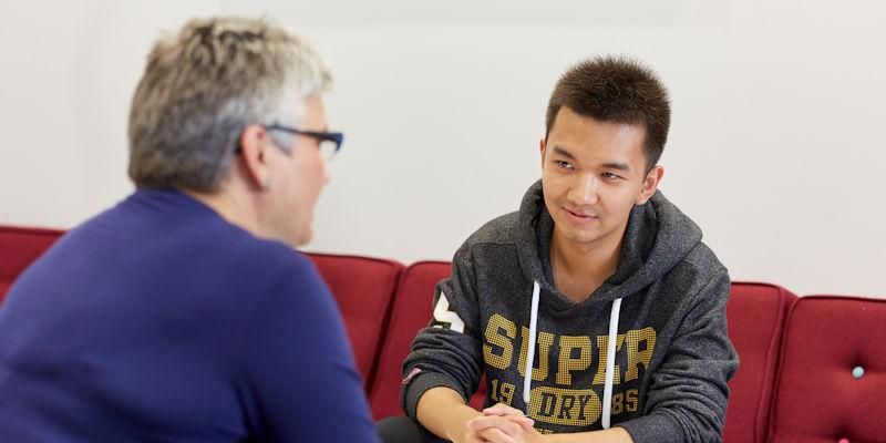 A student talks to a Student Support Officer.