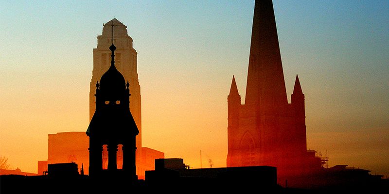 Silhouettes of buildings in Leeds at sunset