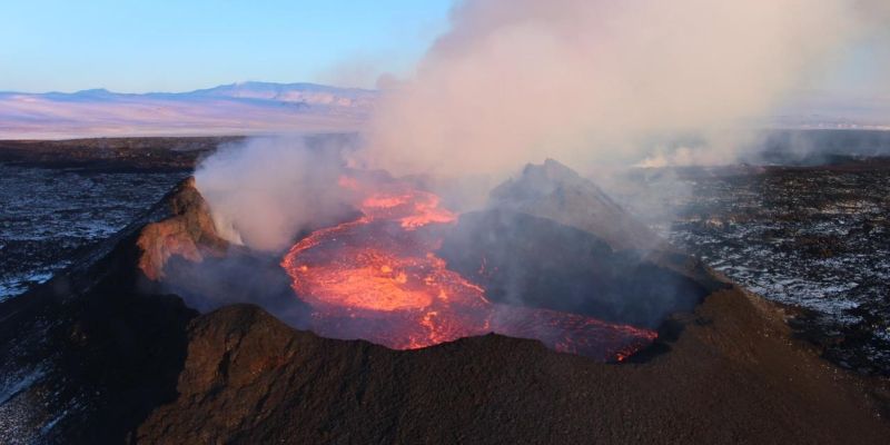 The Holuhraun lava field in Iceland erupting and emitting large clouds of smoke