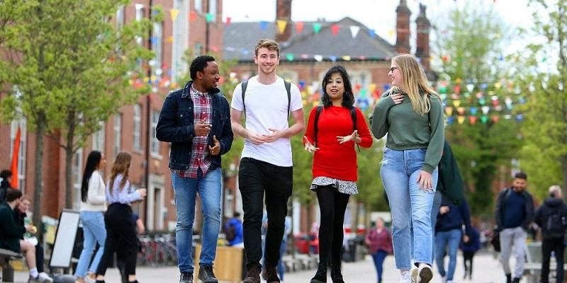 A group of students walking outside Leeds University Union