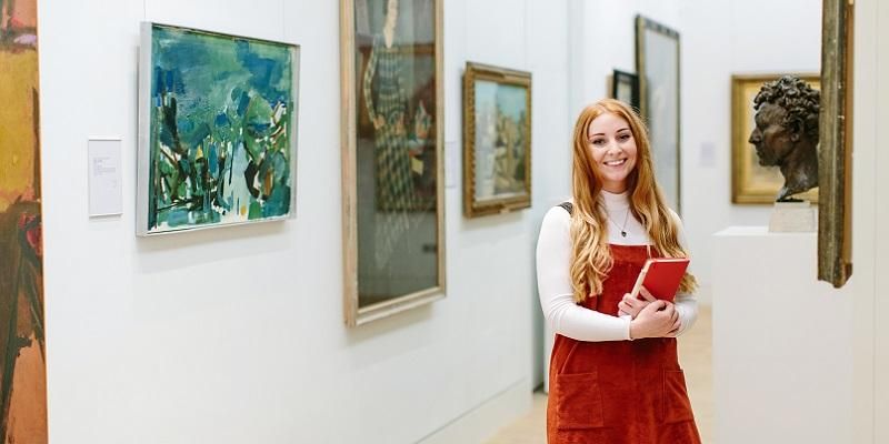 A Masters student in an art gallery