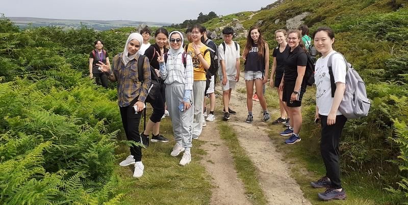 A student group poses for a pictures on a hike in Ilkley, Yorkshire
