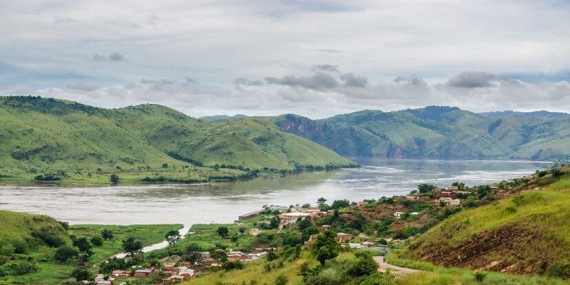 The Congo river, surrounded by mountains on a cloudy day